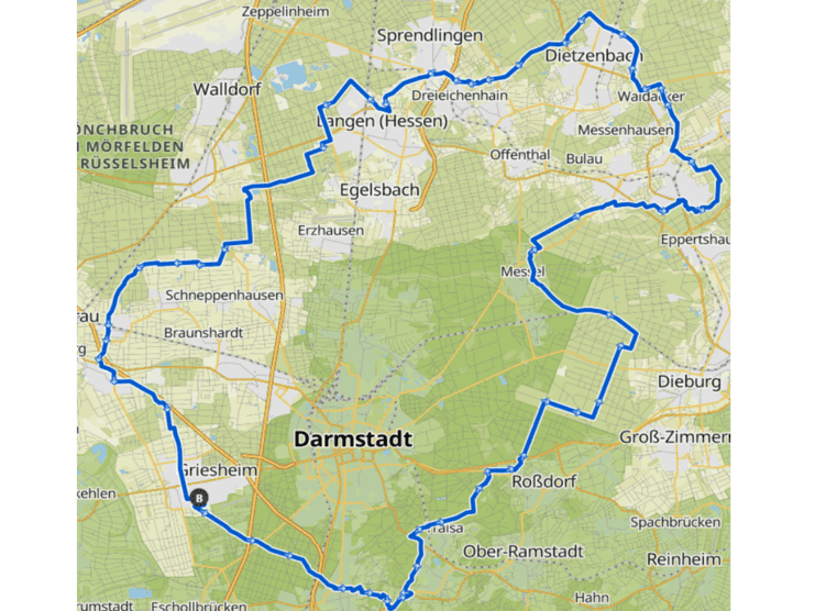 Karte von Darmstadt mit blauer Umrandung, die die Stadtgrenzen und umliegende Gebiete darstellt.